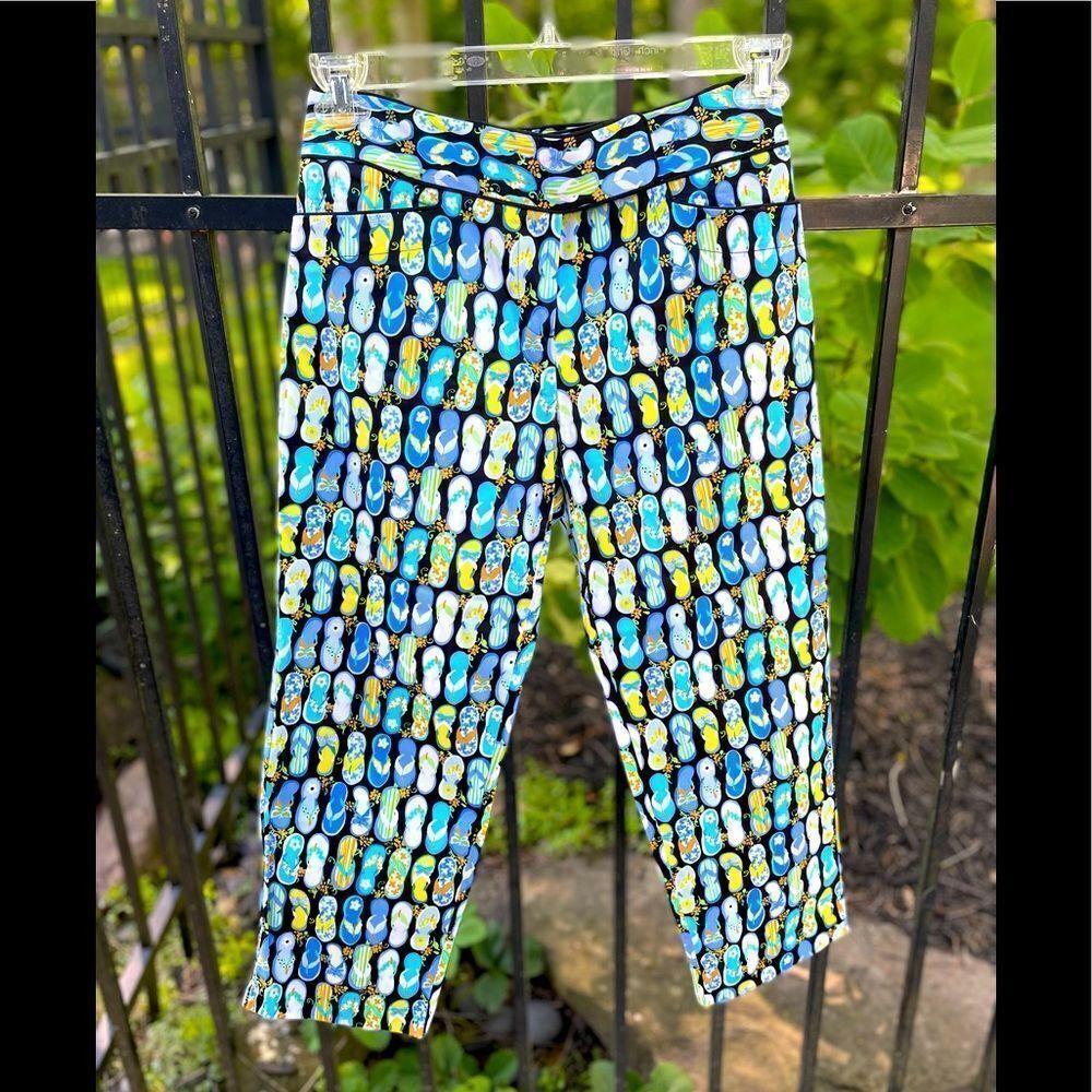 ALANNI Capri style golf pants in black with flip flop print.